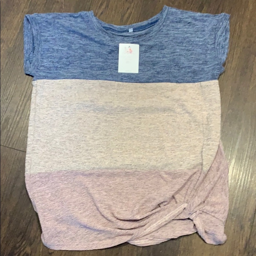 Short sleeve t-shirt. Cute tie detail at bottom.